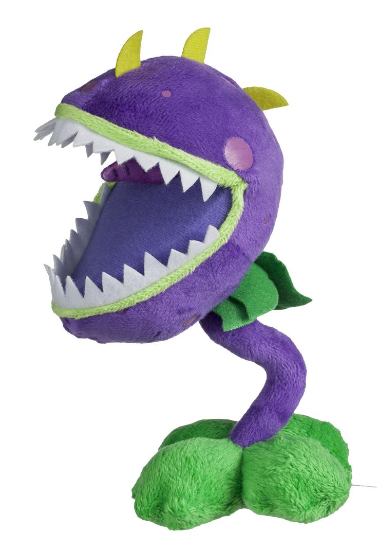 a purple stuffed animal with large teeth and sharp fangs