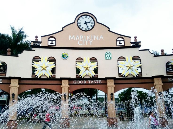 there is a fountain in front of the building