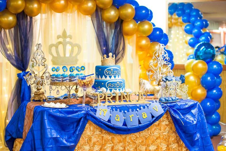 a blue and gold birthday party with balloons