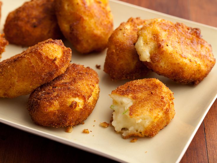 some fried food is on a white plate and ready to be eaten with the rest of it