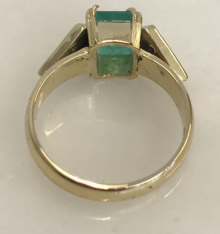 Here is a beautiful 14k yellow gold ring set with a 7 x 5mm emerald and six round diamonds. Such a lovely ring to wear on your right hand or even as an engagement ring! Metal: 14k yellow gold Stones: 1-EM 7x5mm, 6-RB .18cttw. Finger Size: 6.5 (please contact us if you need another size) Weight: 4.6 grams SKU# 21SB063318AIX If you have any questions on this item, please message us! GandDJewelers.etsy.com Please note that all of our pieces have been analyzed & identified by a Gemological Insti 14k Yellow Gold Emerald Ring With Tension Setting, Formal 14k Gold Baguette Cut Emerald Ring, Classic Emerald Ring With Tension Setting For Formal Events, Formal Baguette Cut Emerald Ring In 14k Gold, Formal Emerald Ring With Tension Setting, Yellow Gold Hallmarked Emerald Cut Ring, Fine Jewelry Emerald Ring With Tension Setting, Classic 14k Gold Emerald Ring With Tension Setting, Yellow Gold Emerald Cut Ring Hallmarked