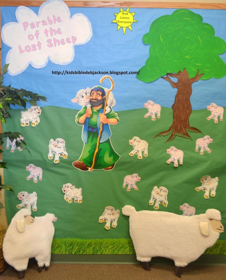 a bulletin board with sheep and jesus on it