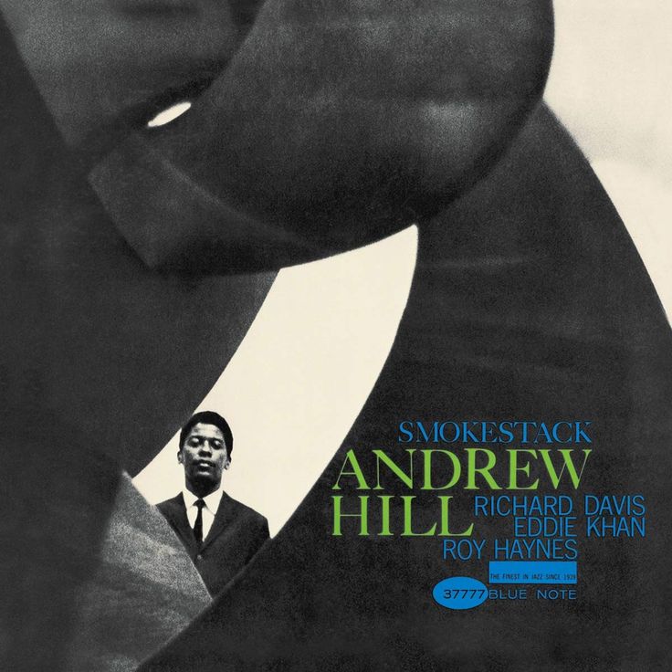 an album cover with a man in a suit and tie