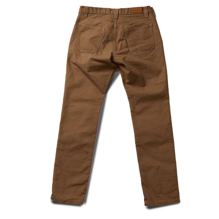 STORY Our flagship pant, the Foundation has been with us since the very beginning. This timeless classic was designed and built to be as ready an option as your favorite pair of jeans; they will no doubt contend for the top position as your go-to pant for daily wear in all conditions. Attention to details and fit, the Foundation is built with function, durability and versatility all in mind. This pant is constructed in our State-side Canvas, a substantial fabric is micro sanded and has a fusion Classic Brown Bottoms With Patch Pockets, Classic Brown Bottoms For Everyday, Brown Tapered Leg Jeans With Welt Pockets, Classic Brown Straight Bottoms, Classic Brown Bottoms With Hip Pockets, Classic Fall Chinos With Hip Pockets, Everyday Chino Cotton Twill Pants With Five Pockets, Classic Chino Cotton Twill Bottoms, Everyday Chinos With Five Pockets