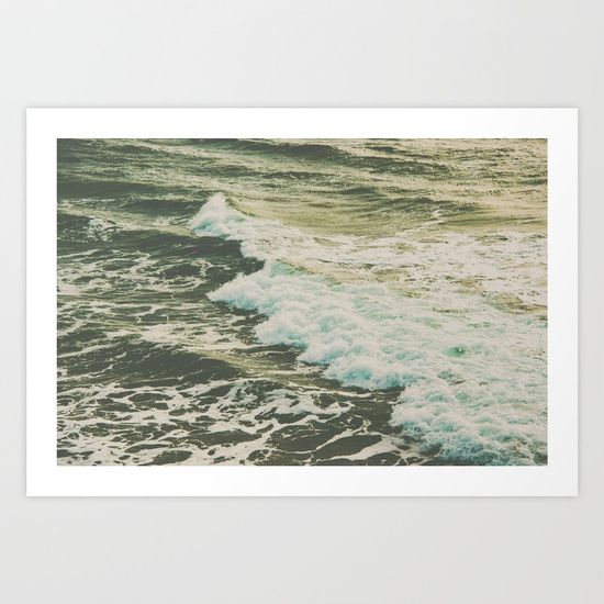 an ocean scene with waves crashing on the shore and green sky above it art print