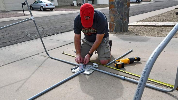 a man is working on some metal bars