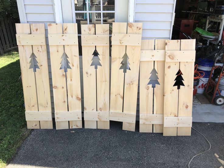 several pieces of wood with christmas trees on them