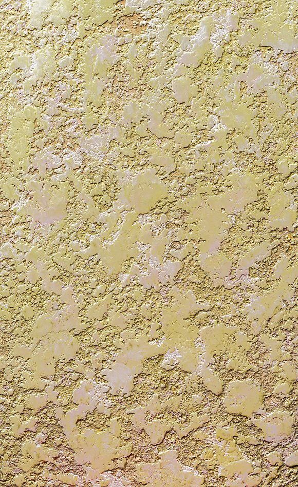 the texture of an old wall is yellow and brown