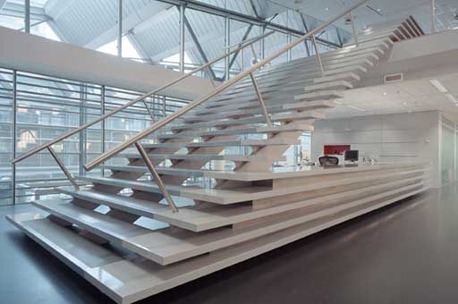 a large white staircase in an office building