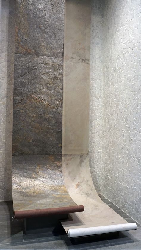 a skateboard ramp in the middle of a room with marble walls and flooring