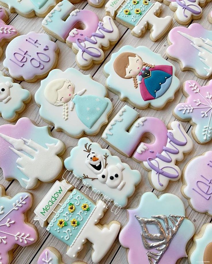 some decorated cookies are sitting on a table