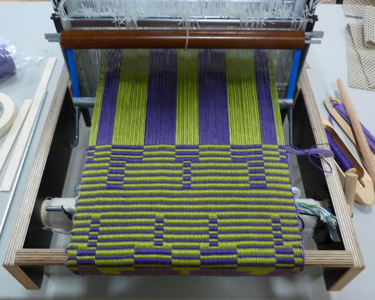 the weaving machine is being used to weave fabric