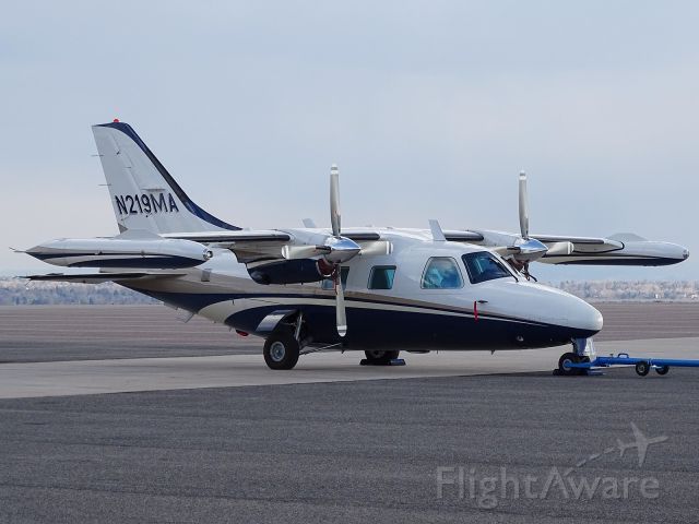 a small plane is parked on the runway