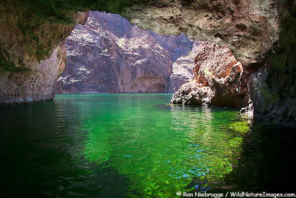 the water is so green that it appears to be in an underground cave or lake