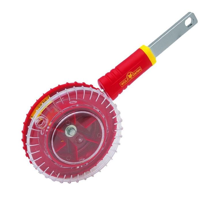 a red and yellow plastic duster on a white background with a metal blade in the center