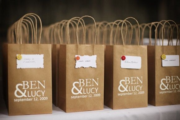 brown paper bags with white writing on them are sitting on a shelf in a store