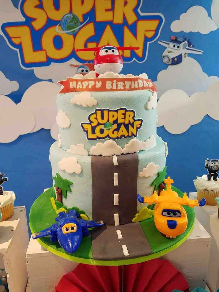 a birthday cake with cars and planes on it