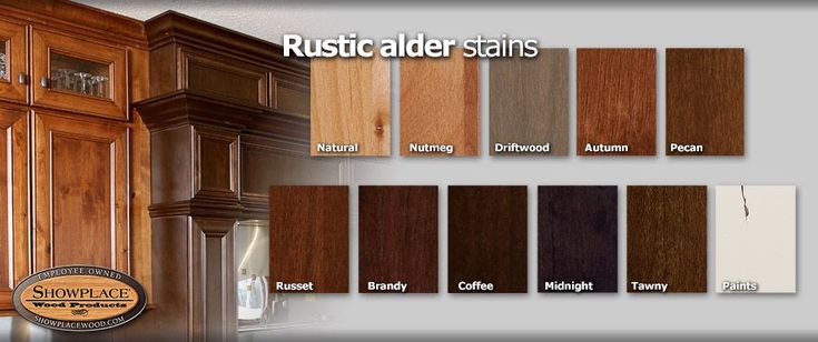 the kitchen cabinets are all wood and have different stain colors on them, including brown