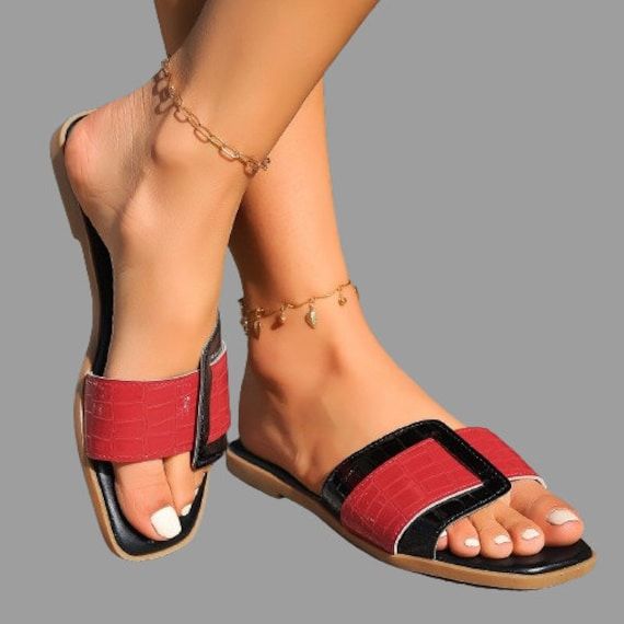 Crafted for durability and designed to keep you looking fabulous, our sandals are your reliable footwear for the sunny season. Perfect for beach days, poolside lounging or casual outings, these sandals blend vintage charm with modern comfort.  PRODUCT DETAILS  Upper material: PU Lining material: PU Insole material: rubber Sandals Sliders Slip-on Heel height: 1.5cm Uk sizes: 3-8 Casual Footbed Sandals With Single Toe Strap For Vacation, Red Sandals With Buckle Closure For Summer, Red Buckle Closure Sandals For Summer, Trendy Beach Slip-on Footbed Sandals, Trendy Slip-on Footbed Sandals For Beach, Casual Slides With Single Toe Strap For Vacation, Vacation Slippers With Buckle Closure, Casual Footbed Sandals With Single Toe Strap For Summer, Casual Vacation Slides With Single Toe Strap