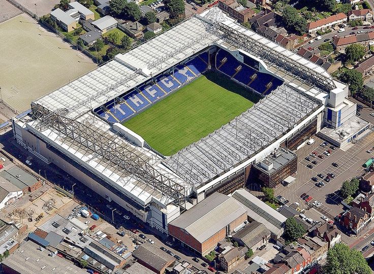 an aerial view of the stadium from above, looking down on the field and surrounding buildings