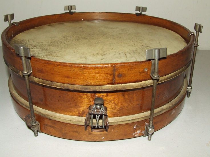 an old wooden drum with metal handles