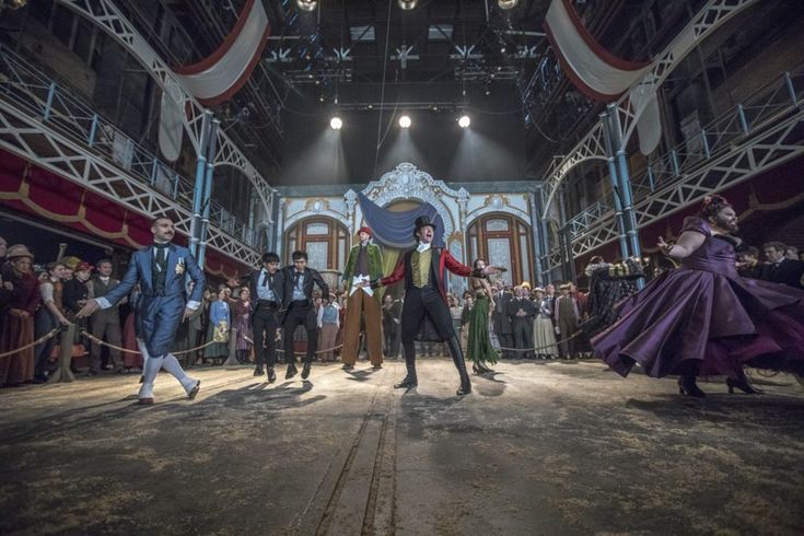 a group of people standing on top of a stage