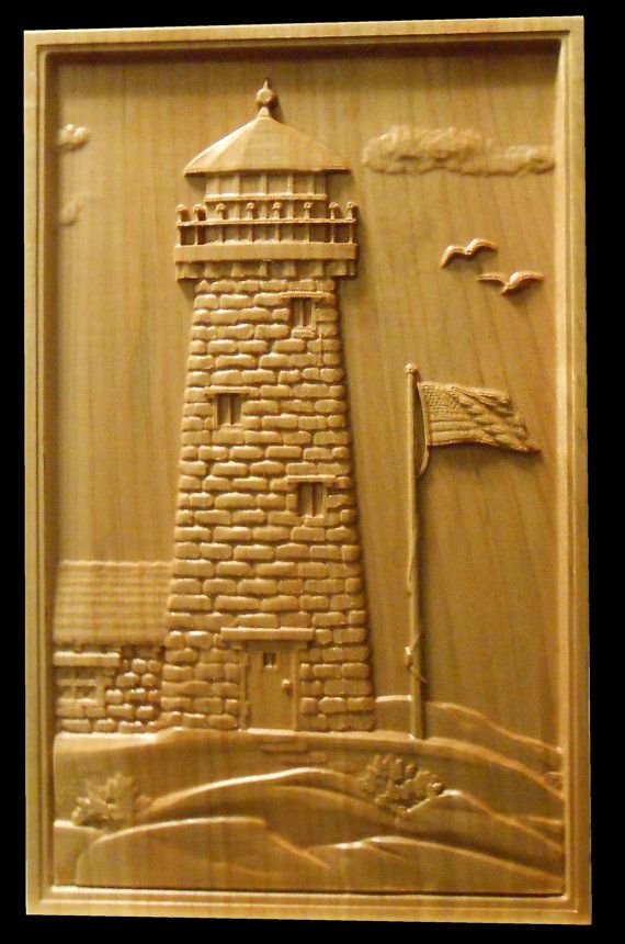 a carved wooden plaque with a lighthouse and flag in the center, on a black background