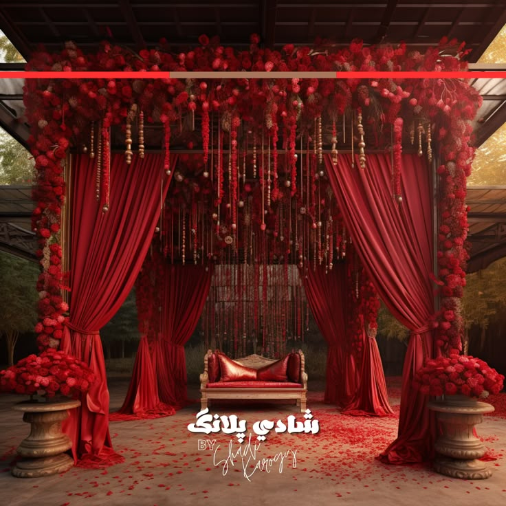 a bed with red curtains and flowers on the floor in front of a gazebo