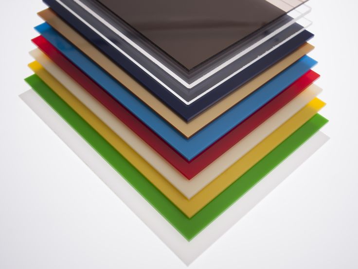 a stack of assorted colored sheets on top of each other in various sizes and colors