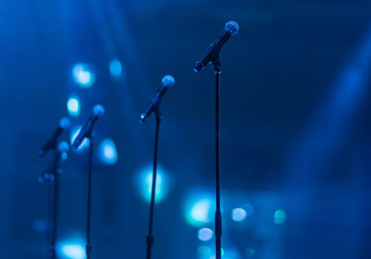 the microphones are lined up in front of blue lights