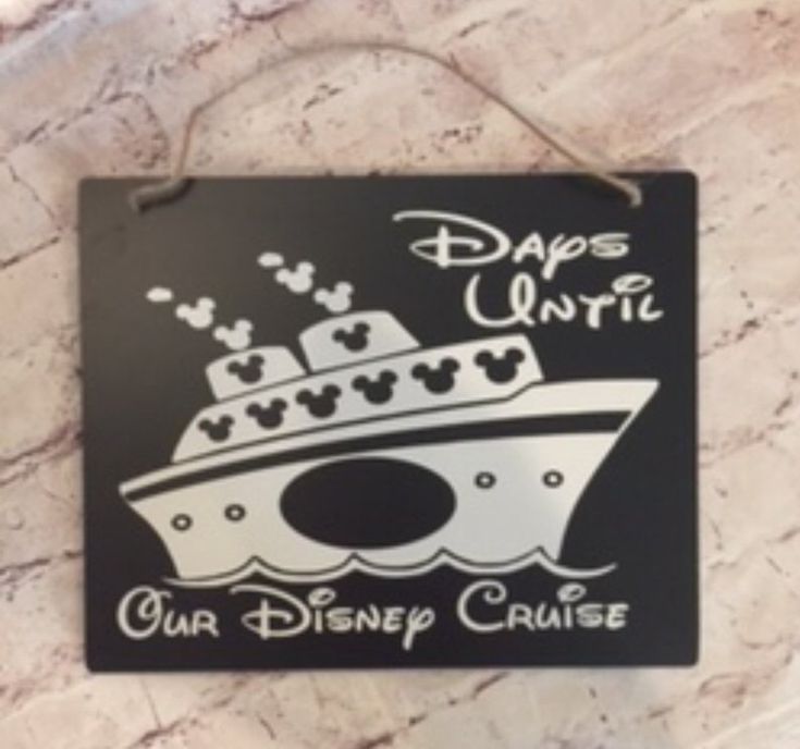 a sign hanging from the side of a wall that says, daps unfre our disney cruise