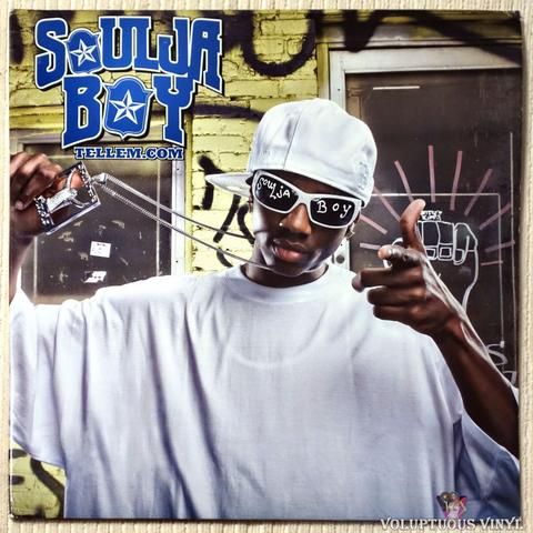 a man in white shirt and sunglasses holding up his hand with the word southern boy on it