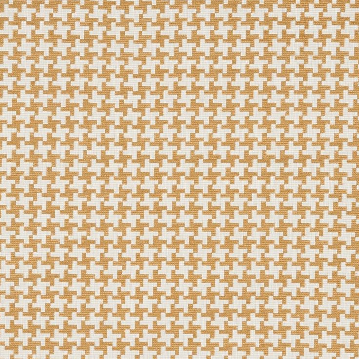 an orange and white pattern on fabric