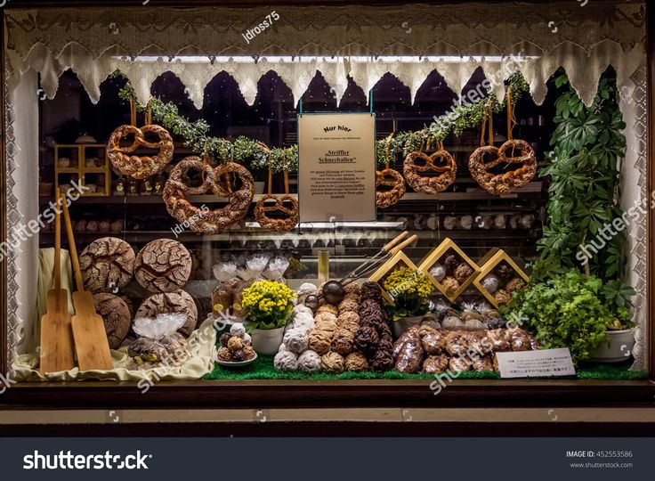 a display case filled with lots of different types of foods and vegetables on display in a store