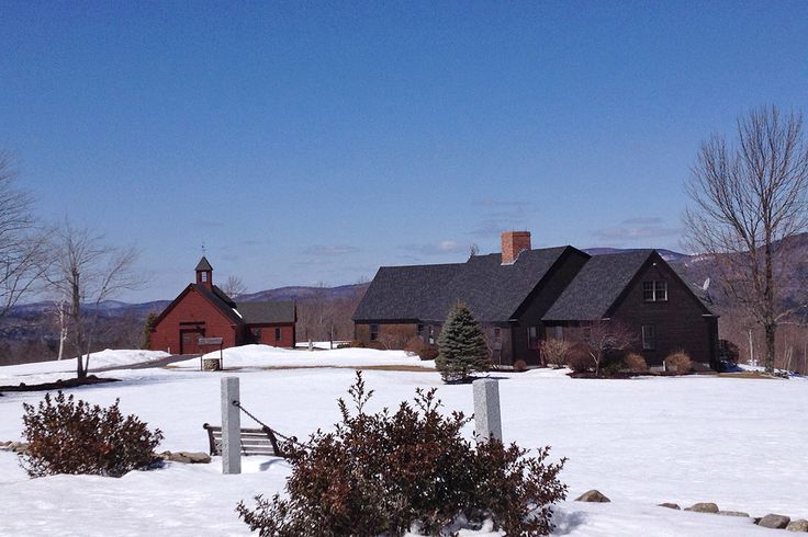 a house in the middle of a snow covered field