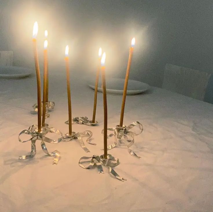 a group of candles sitting on top of a table