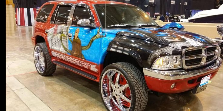 a red and black truck with an american flag painted on it