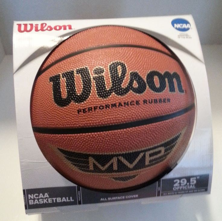 a close up of a basketball in a box on a table with the logo wilson performance rubber