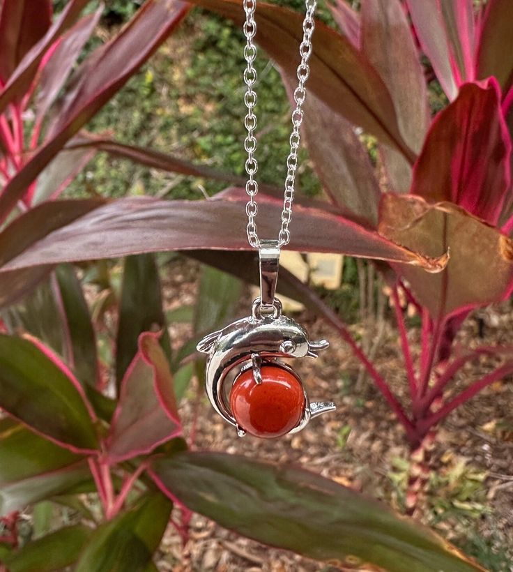 Dainty Red Jasper Dolphin Pendant Red Jasper Crystal Necklace Root Chakra Healing Due to its truly extraordinary metaphysical properties, red jasper stones are believed to be a one-stop-shop for manifesting courage, strength, and wisdom. In the same way that a beautifully rendered landscape echoes our complex, vast ecosystem, these unique gemstones remind us to consider the priceless planetary elements that give us life. The combination of minerals that give red jaspers stones their opaqueness a Spiritual Red Necklace With Natural Stones, Spiritual Jasper Necklaces For Gifts, Spiritual Jasper Necklace For Gift, Red Spiritual Crystal Pendant Necklace, Spiritual Red Crystal Pendant Necklace, Red Natural Stone Crystal Pendant Necklace, Red Spiritual Pendant Crystal Necklaces, Red Gemstone Pendant Crystal Necklace, Red Gemstone Pendant Crystal Necklaces