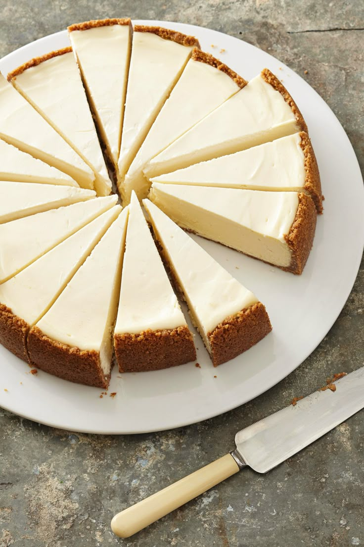 a cheesecake is cut into slices on a plate