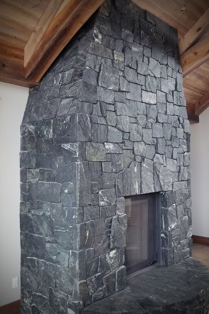 a large stone fireplace in a living room