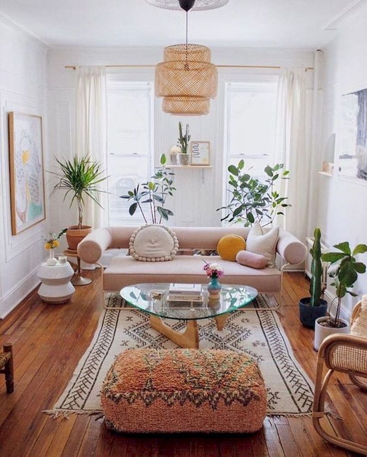 a living room filled with furniture and plants