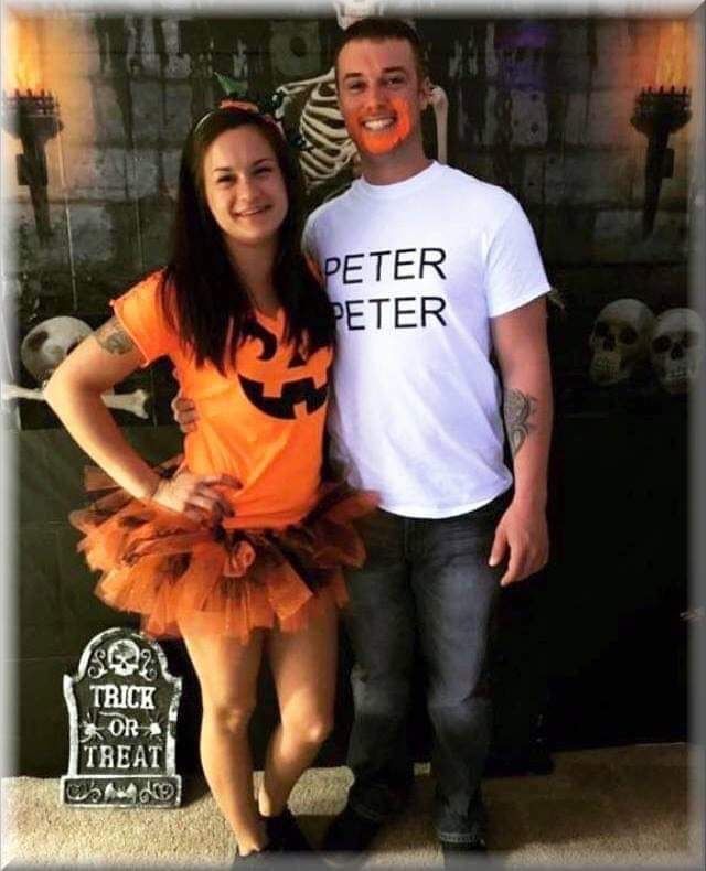 a man standing next to a woman wearing a pumpkin shirt and tutu with the words peter peter on it