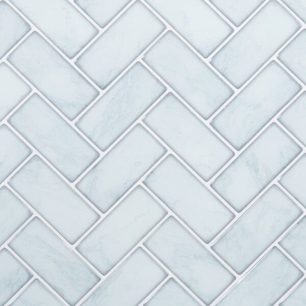 white marble herringbone tile pattern with light gray grouting in the center and bottom