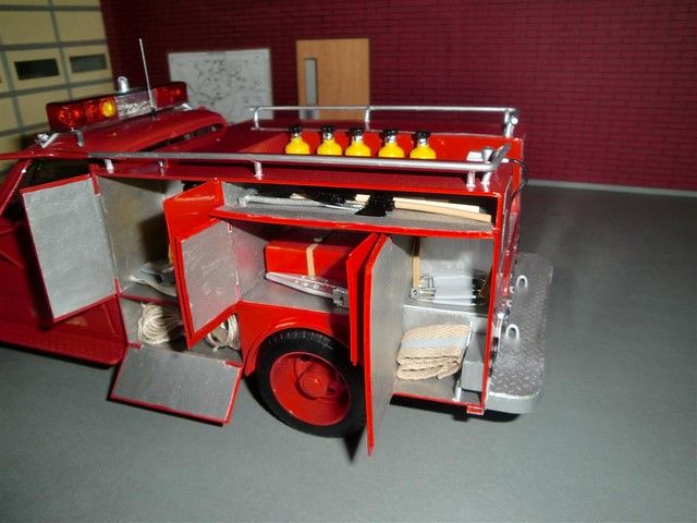 a toy fire truck with its door open