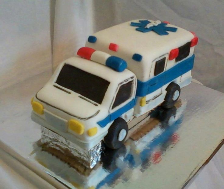 a cake shaped like an ambulance on top of a table