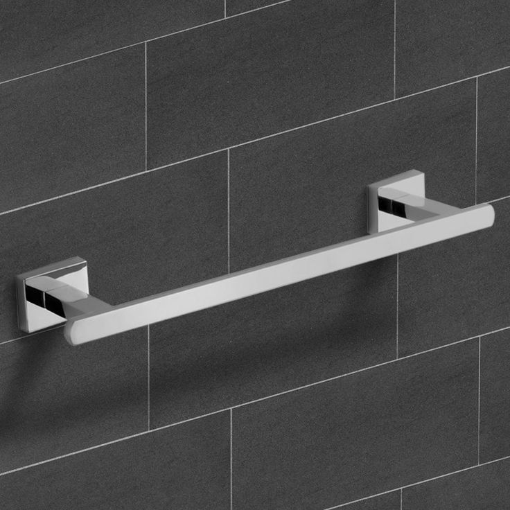 the modern towel bar is mounted on the wall