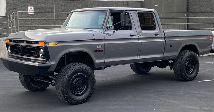 a large gray truck parked in a parking lot