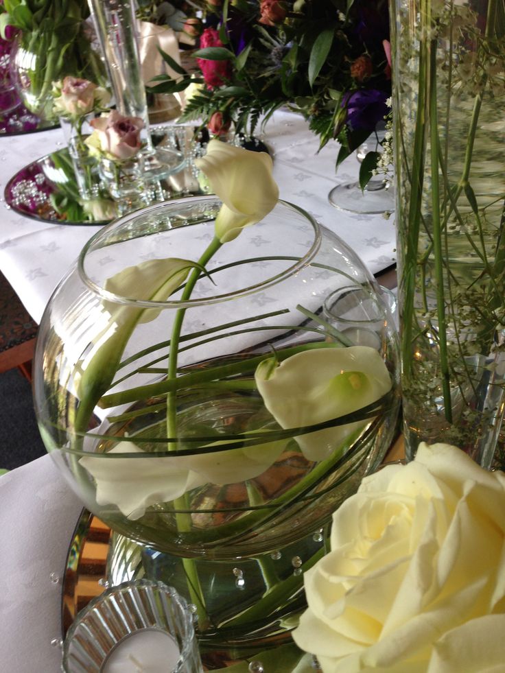 there is a vase with flowers in it on the table