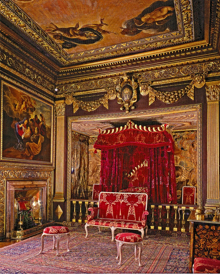 an ornately decorated room with red and gold furniture